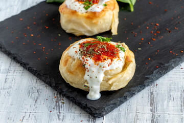Traditional Turkish Borek with minced meat and yogurt. Yoghurt Burek Dumplings