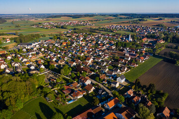 Aerial view of the village Affing in Germany on an early morning in spring.	