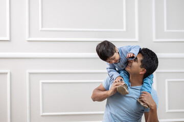 Mexican parent and child playing