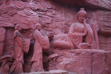 Asian statues red stone