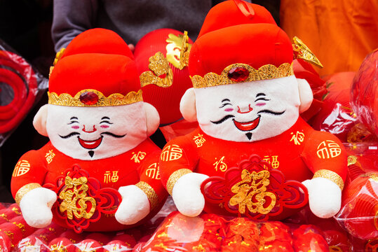 God of Wealth dolls.Spring Festival and Chinese new year decoration. The translation of the text on the clothes is good luky and good fortune.