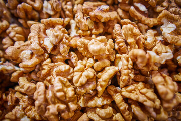 Heap of peeled walnuts background