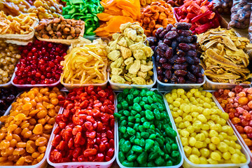 Transparent baskets with dry fruits in the market