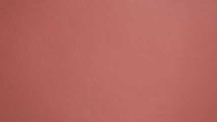 Cement wall painted dark pink. Abstract background with pink texture patterns for presentations and articles or copy space. Selective focus