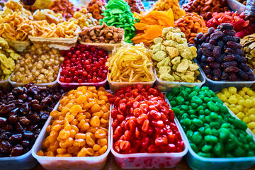 Transparent baskets with dry fruits in the market