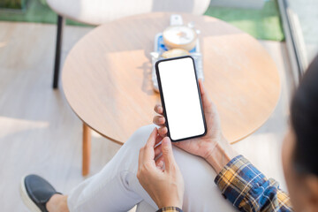 cell phone blank white screen mockup.woman hand holding texting using mobile on desk at office.background empty space for advertise.work people contact marketing business,technology