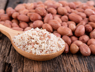  ground peanuts on wooden background