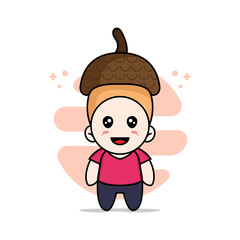 Cute kids character wearing nut costume.