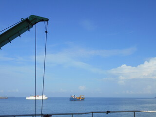 View of the deck cranes fitted onboard a merchant vessel, bulk carrier type vessel is at berth with...