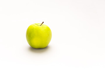 Green apple on a white background. Apple is a healthy fruit.