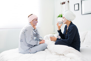 Female best friends sharing personal stuff in a slumber party