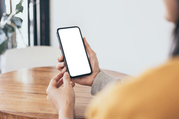 cell phone blank white screen mockup.woman hand holding texting using mobile on desk at office.background empty space for advertise.work people contact marketing business,technology