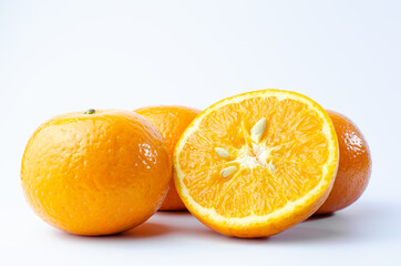 Orange on white background isolated, Asian tropical fruits whole good for healthy drinks and juice. Very natural sweet flavor. Tangerine, mandarine, Thai honey sweet green. Close up shot food concept