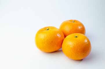 Orange on white background isolated, Asian tropical fruits whole good for healthy drinks and juice. Very natural sweet flavor. Tangerine, mandarine, Thai honey sweet green. Close up shot food concept