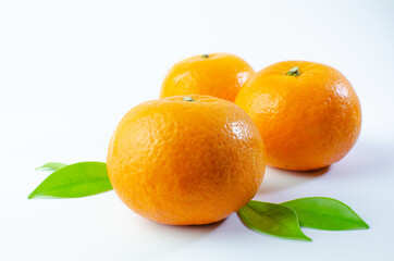 Orange on white background isolated, Asian tropical fruits whole good for healthy drinks and juice. Very natural sweet flavor. Tangerine, mandarine, Thai honey sweet green. Close up shot food concept