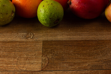 Tropical Fruits Background on Wooden Table
