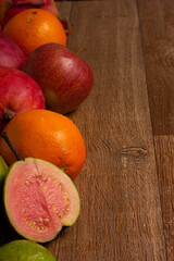Fototapeta na wymiar Tropical Fruits Background on Wooden Table