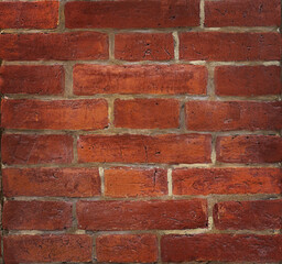 Red brick wall close-up horizontal outdoors shot.