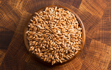 Bowl of Spelt Grain on a Wooden Butchers Block