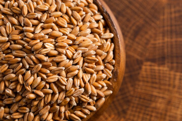 Bowl of Spelt Grain on a Wooden Butchers Block