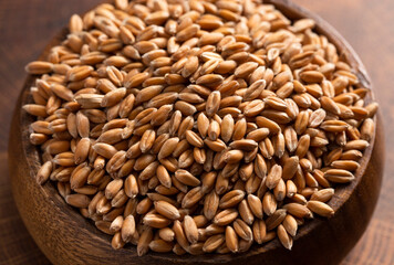 Bowl of Spelt Grain on a Wooden Butchers Block