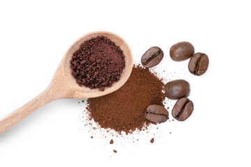 Instant coffee powder in wooden spoon with roasted coffe beans isolated on white background. Top view.