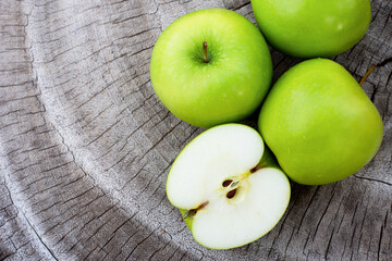 green apples on wooden table