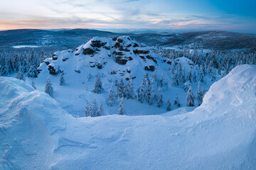 Panoramic landscape of Jizera Mountains, view from peak Izera with frosty spruce forest, trees and hills. Winter time near ski resort, blue sky background. Liberec, Czech Republic, Northern Bohemia