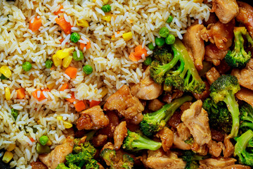 Delicious asian meal rice with chicken and broccoli.