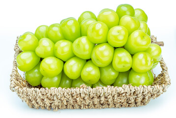 Shine Muscat Grape in Bamboo basket isolated on white background, Green grape isolated on white.