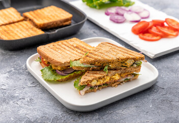 vegetable paneer sandwich using cottage cheese  with tomato, onion and lettuce with chutney 