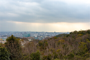 Fototapeta na wymiar Distant view of Nishinomiya city, Osaka city from Kabutoyama forest park in Nishinomiya, Hyogo, Japan