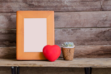 Beautiful mock up wooden frame decorated with valentine heart and cactus