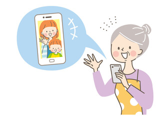 スマホでビデオ通話するシニア女性と娘と孫