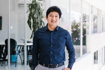 latin Man portrait looking to camera outside office in Mexico city