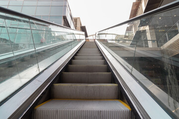 Fototapeta premium Escalators inside a mall are empty of people due to the closure of shopping centers by the government to prevent infection with the Corona virus, Ramot neighborhood, Jerusalem, Israel