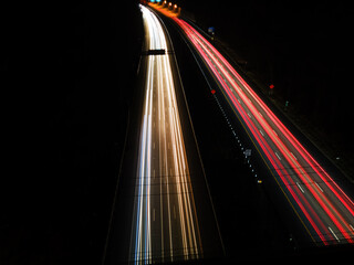 Fototapeta na wymiar Streaking Lights from Cars on Highway at Night