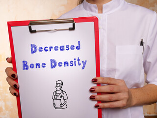 Conceptual photo about Decreased Bone Density with handwritten phrase.
