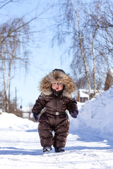 A cute little boy having fun outdoors on a winter day. Wintertime, entertainment, activity, childhood, holidays concept.	
