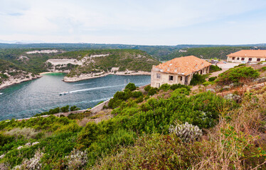 Fototapeta na wymiar Bonifacio, Corsica. Coastal view with abandoned houses