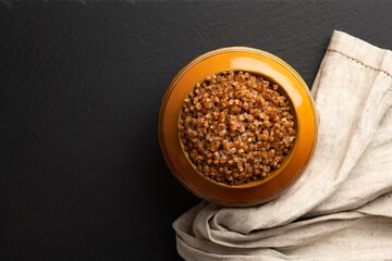 buckwheat porridge cooked in a clay pot in the oven, flat lay