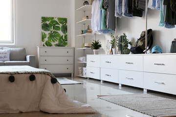 Interior of white modern bedroom with wardrobe