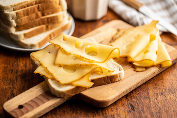 Sandwich bread with hard cheese.