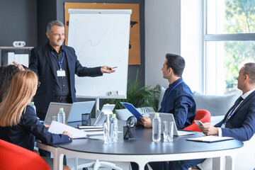 Businessman giving presentation in office