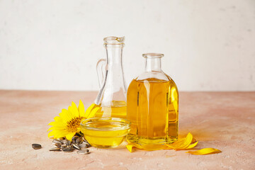 Composition with sunflower oil on color background
