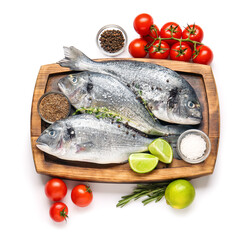 Raw dorado fish with ingredients on white background