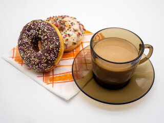 assorted glazed donuts and coffee
