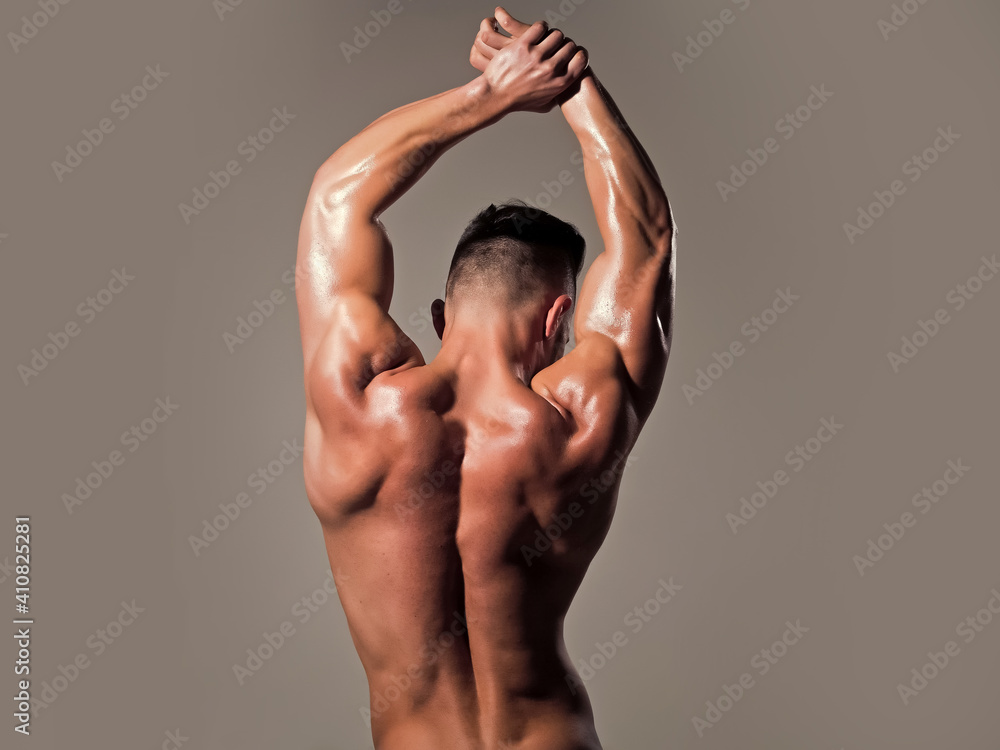 Wall mural man with muscular wet body and back. strong man or muscular men. back view of a muscular man posing 