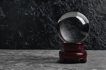 Crystal ball of fortune teller on dark background