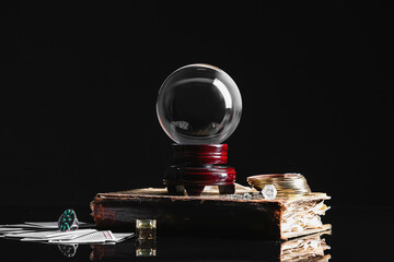 Accessories of fortune teller on dark background